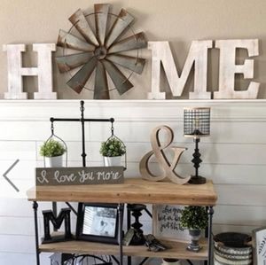 Huge wooden HOME sign and metal windmill